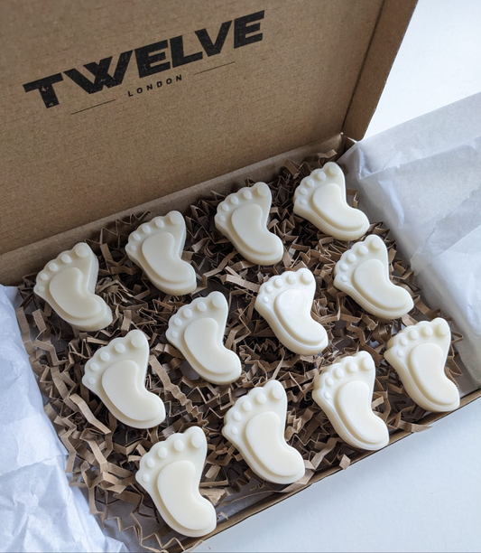 Twelve London Baby feet wax melts in a branded pip box